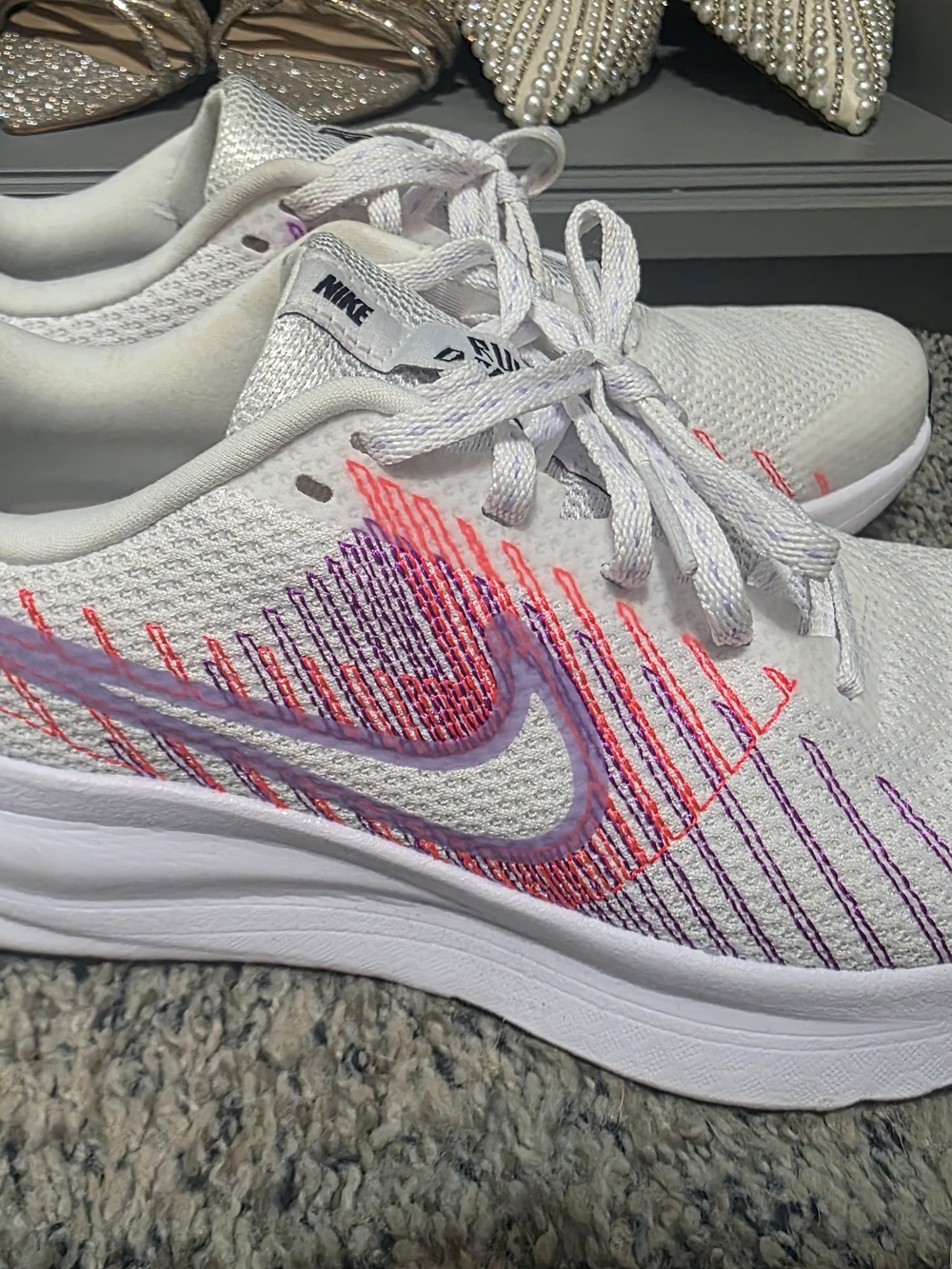 Nike Women’s White Running Shoes with Purple-Pink Accents
